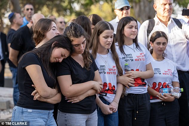 Mourners gather at the funeral of Lianne, Noiya and Yahel Sharabi at Kfar Sharif Cemetery