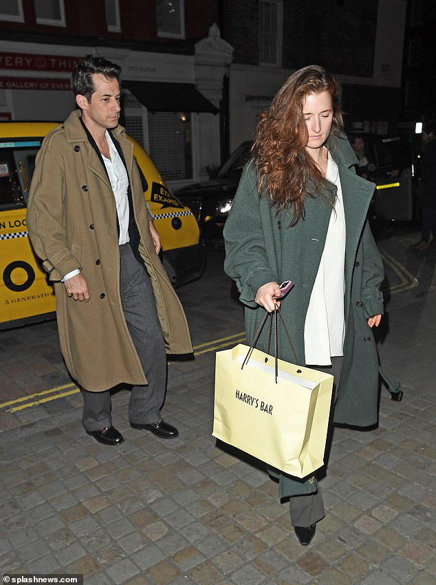 Meryl Streep's daughter Grace also opted for gray trousers and a white shirt, which she wore loose under a long green mac.