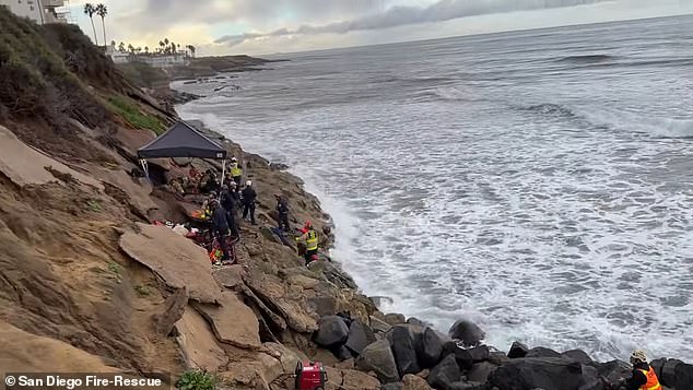 Two teenagers heard a man screaming after walking along the cliff at Orchard Street and Cable Street around 3:40 p.m. Thursday and immediately called 911