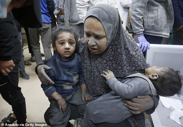 According to Fox News, an internal memo was sent by an employee of the Israeli office pointing out an uneven policy regarding the paid videos from both sides of the conflict.  Pictured: Injured mother and children taken to a hospital in Gaza after an Israeli airstrike