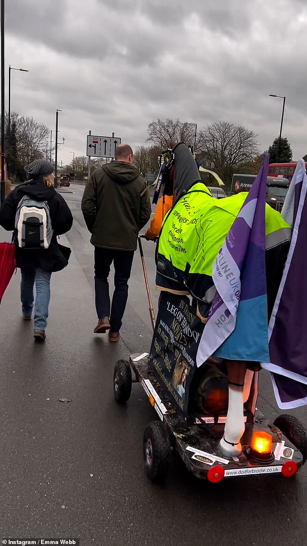 Ms Webb posted a video to her Instagram account of the two walking and talking through Slough on day 13 of her fundraising campaign, dragging the horse behind them.