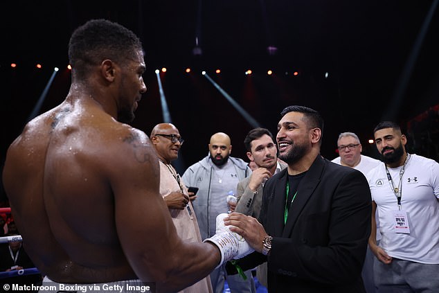 Joshua also shook hands with Amir Khan in the ring after his victory