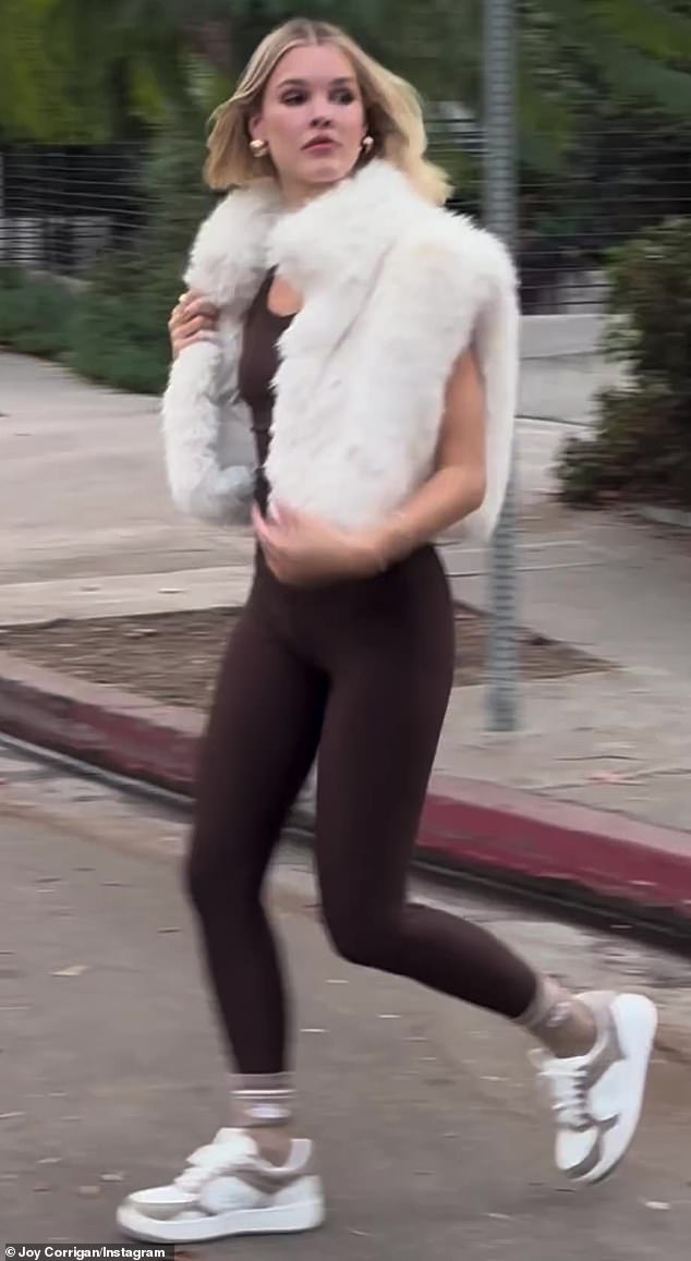 In the clip, Corrigan wore a sleeveless brown top and matching leggings, both of which hugged her chiseled figure.
