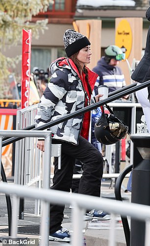 The reality TV personality also wore black ski pants and a Chanel hat