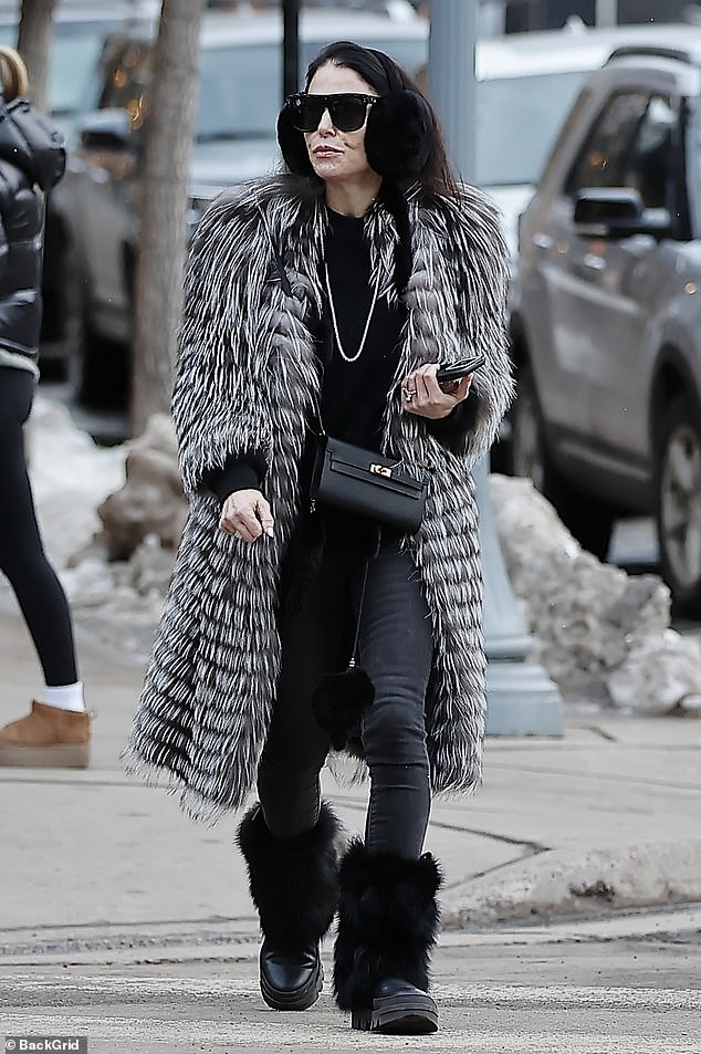 The reality TV personality, 53, put on a glamorous show as she donned a black and white fur coat over her monochrome ensemble as she walked