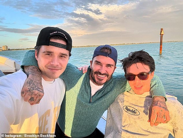 Former footballer David showed off his own legendary good looks and was seen in another photo with his arm around his two sons