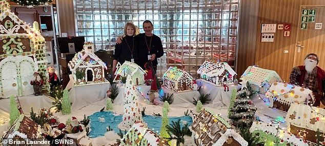 Brian Launder, 75, and his wife Carole, 70, on board the MS Maud next to a Christmas show before the storm hit