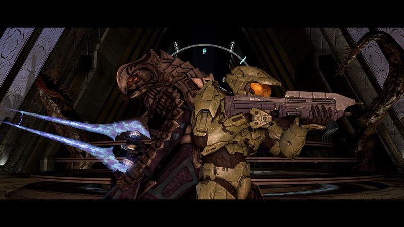 The Arbiter and Master Chief stand back to back, with their weapons in hand, in this screenshot from Halo 3