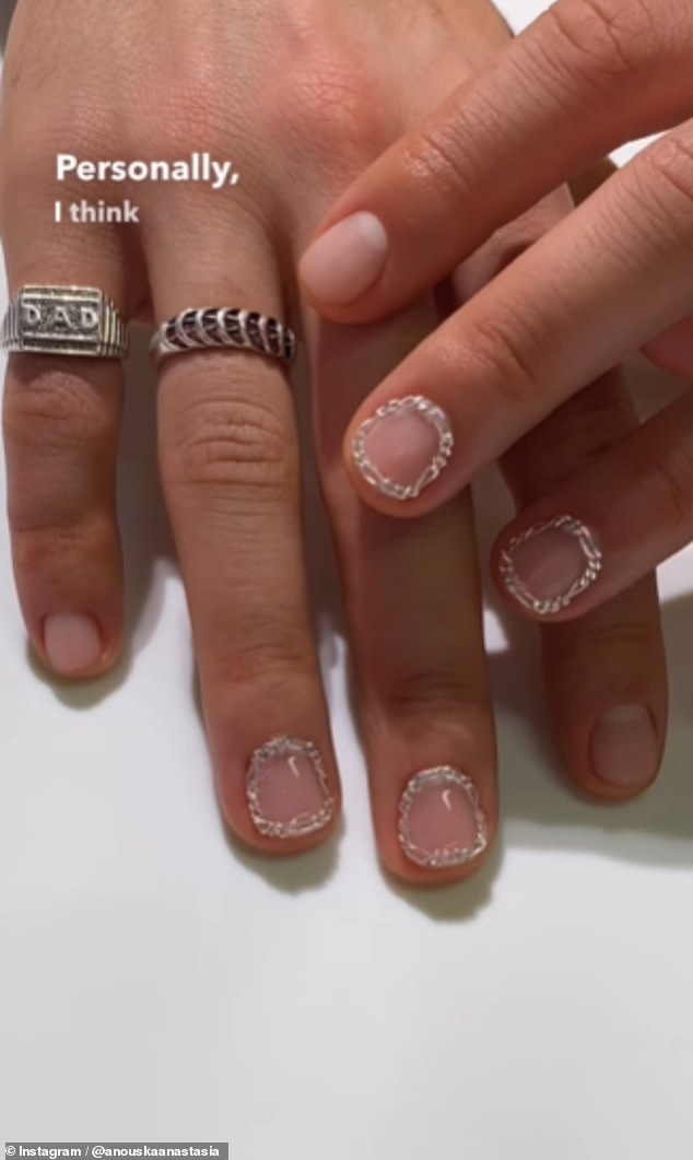 The 'Chained Windows Men's Mani' is a type of nail art with a silver jewelry chain around a well-groomed nail