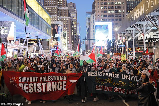 Protesters gather in New York on December 18 for a pro-Palestinian activist march as they take part in a global assault on Gaza to demand a ceasefire