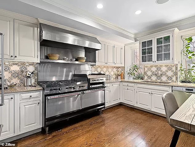 The full kitchen is a chef's dream with a Garland gas range, SubZero refrigerator, dishwasher and two pantries