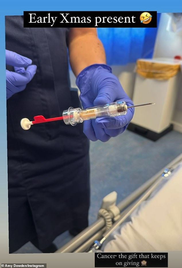 Wearing a festive sweater and beaming bravely in the snaps, she thanked hospital staff before joking that a big injection was her 'early Christmas present'