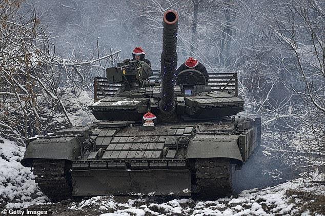 It comes amid declining morale among Zelenskiy's troops as the war enters its second harsh winter.  In the photo: a tank crew in Christmas outfit carries out a combat mission