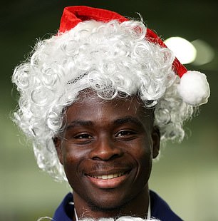 The official English account posted a photo of Saka in a Santa outfit