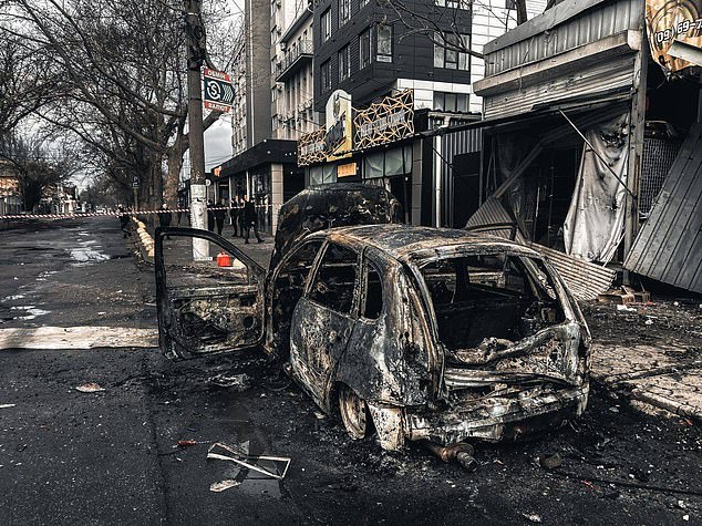 Andrii Yermak, the head of the Ukrainian president's office, shared photos of the aftermath in Kherson, including burned cars and buildings