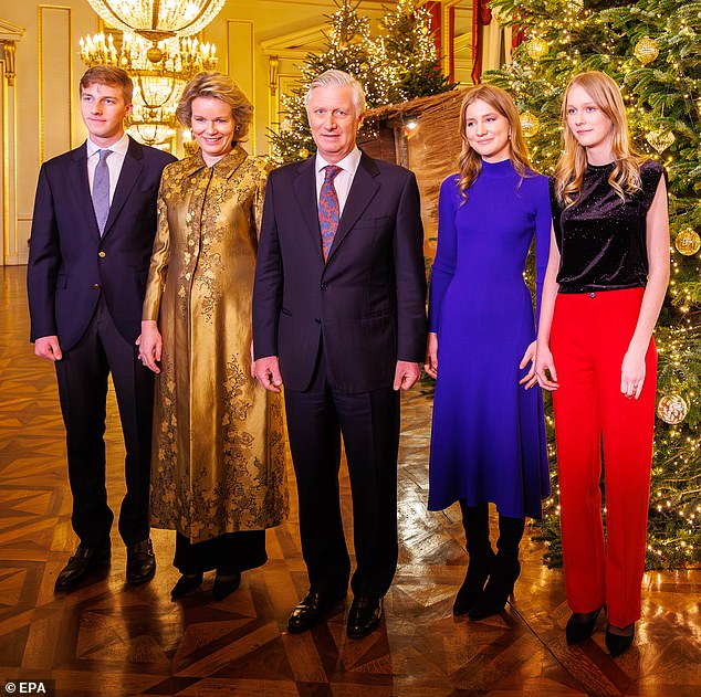 Princess Elisabeth of Belgium was effortlessly stylish in an azure dress as she joined her siblings and parents for a Christmas reception at the Royal Palace in Brussels