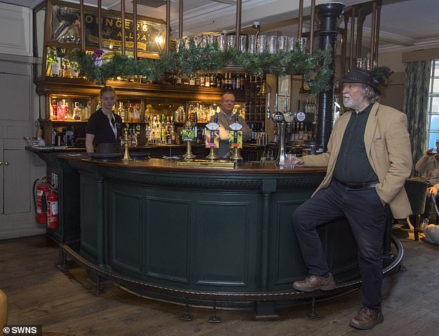 Steve Harvey recreates the 1938 photo of the bar at The Sheep Heid Inn, Duddingston, Edinburgh