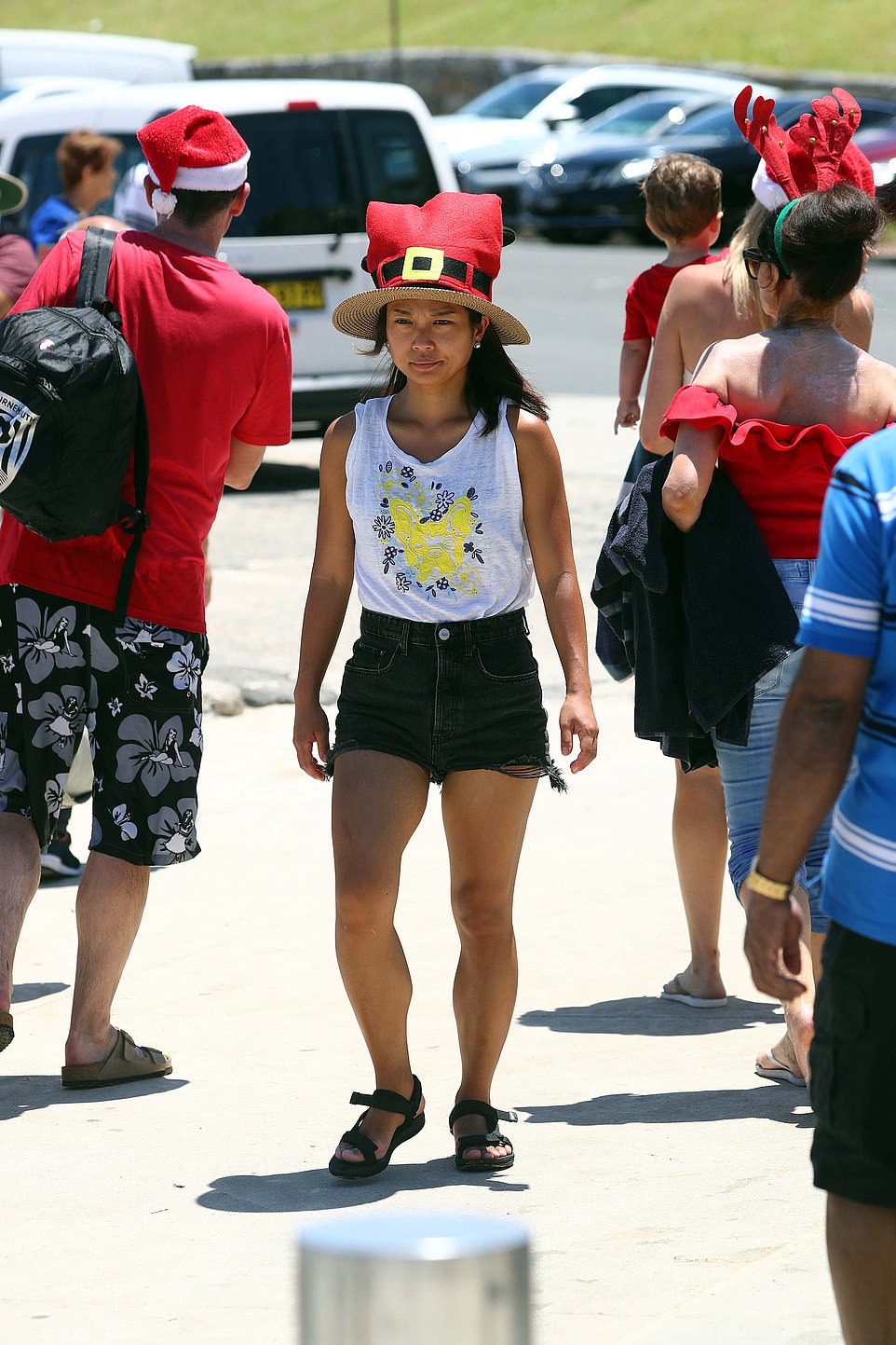 A woman brought a Christmas-themed hat to the beach on Monday