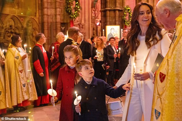 Prince Louis stood next to his mother and sister while holding a candle during the Christmas concert