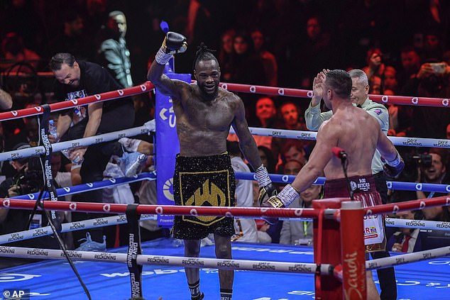 Deontay Wilder bizarrely raised his hand after fighting Joseph Parker – when defeat was clear