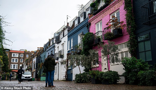 Every day, dozens of tourists line up outside the three-story pink house