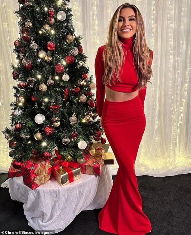 The television personality dressed in a bright red coordinate to keep the holiday spirit in check