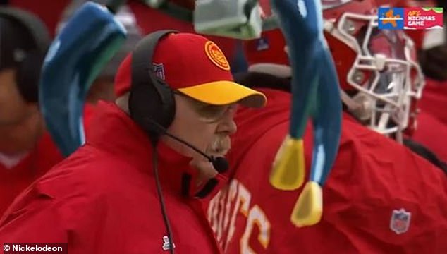 During the third quarter, Chiefs head coach Andy Reid was lifted into the air by a giant claw