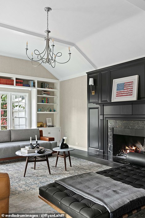 There are plenty of spaces reserved for entertaining, such as a living room with a black marble fireplace