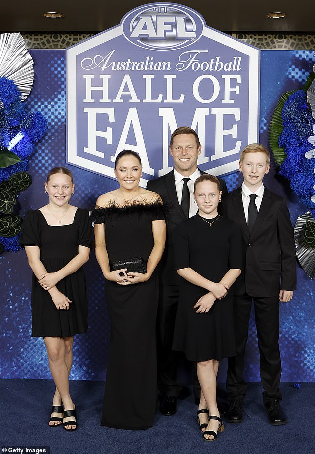 The Hawks coach (pictured with his family at this year's AFL Hall of Fame ceremony) was first admitted to hospital on December 23