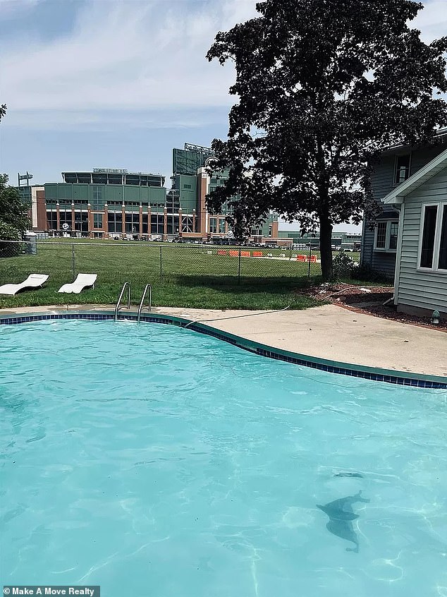 On a warm fall day, only a fence separates the backyard from the excitement of the stadium.  Joining in the enthusiasm would certainly be an option for any owner