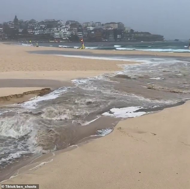 The heavy rain also carved out a river as water rushed out to sea, with one local saying they wanted to test the rapids on a boogie board