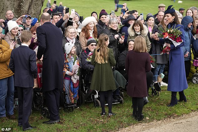 Prince George, William, Prince of Wales, Princess Charlotte, Mia Tindall and Kate, Princess of Wales meet well-wishers after attending the Christmas Day service at St Mary Magdalene Church in Sandringham