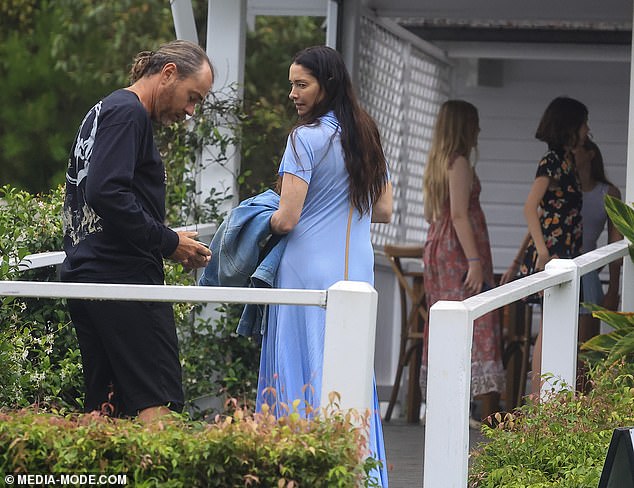 Erica wore a denim jacket over her arm and chatted warmly with Shannon as they went inside