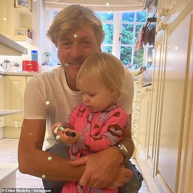 Chloe, the daughter of Richard, 67, (pictured) and Judy Madeley, posted a photo of her father hugging his granddaughter Bodhi earlier today.
