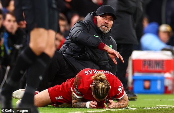 LIVERPOOL, ENGLAND – DECEMBER 23: Liverpool Manager Jurgen Klopp & Konstantinos Tsimikas of Liverpool react during the Premier League match between Liverpool FC and Arsenal FC at Anfield on December 23, 2023 in Liverpool, England.  (Photo by Chris Brunskill/Fantasista/Getty Images)