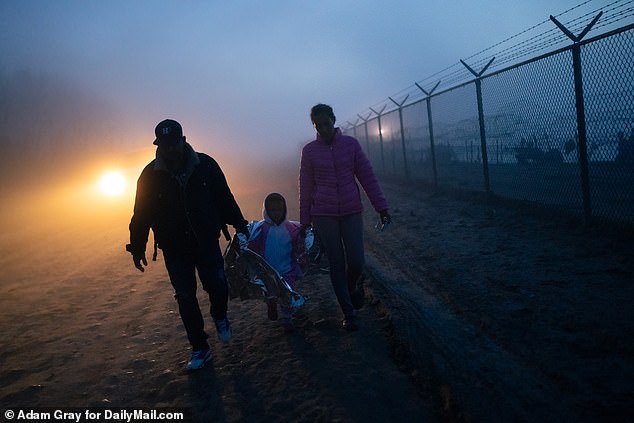 Venezuelan migrant Diana walks with her daughter Samira, 4, and husband Juan Brazon, after crossing the border into Eagle Pass, Texas, United States.  December 26, 2023