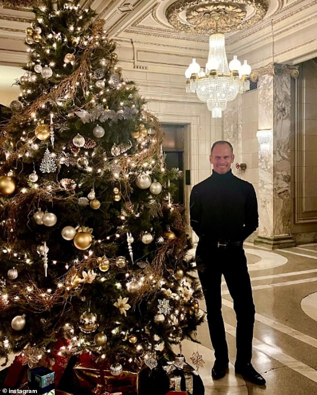 Cooper's last post on social media was of himself standing next to a Christmas tree in the lobby of the historic police building that houses three apartments he sold.