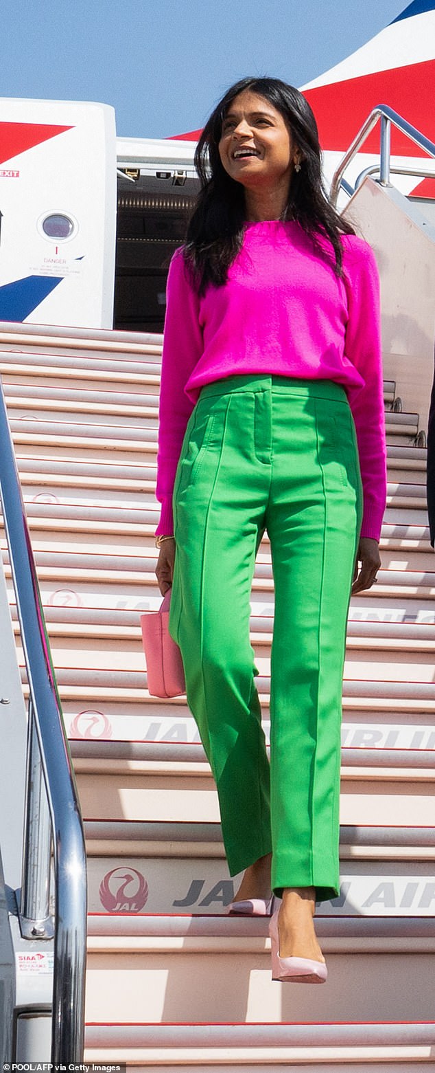 Rishi Sunak's wife Akshata Murty's most memorable outfit of the year was the Chinti and Parker fuchsia cashmere top with lime green Me+Em trousers when she arrived in Japan in May.