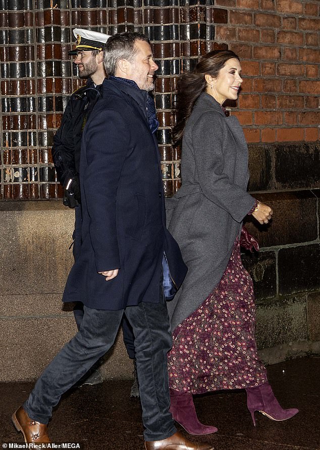 Mary looked stylish in a $1,400 floral Saloni maxi dress, which she paired with Aquazzura's knee-high suede Gainsbourg 85 boots, a gray soft coat and burgundy gloves