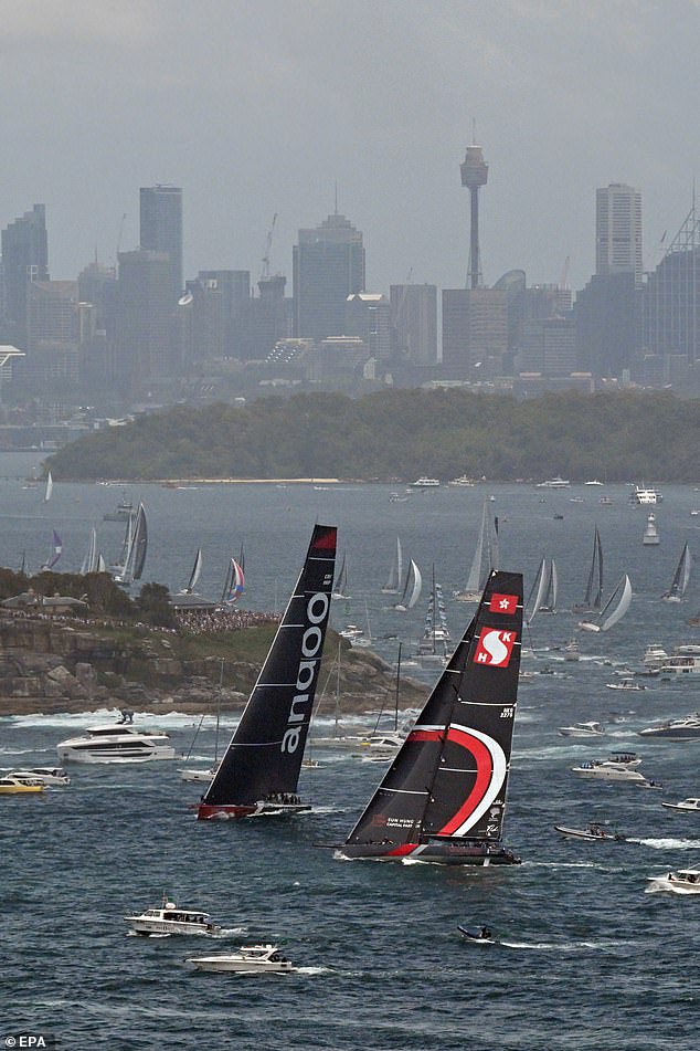 Top contenders for line honors Comanche (left) and Scallywag (right) are pictured at the start of the bluewater classic with Sydney's spectacular skyline as a backdrop