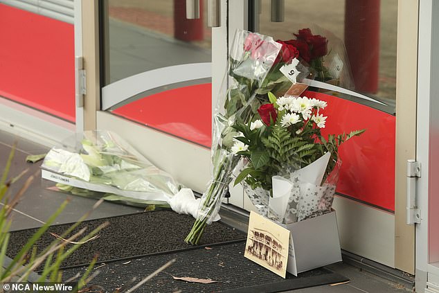 Flowers can be viewed at the Makelaarsgroep on Thursday, a day after the alleged attack