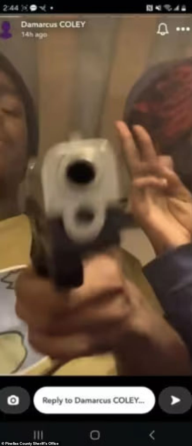 Damarcus Coley, 14, poses with his gun, hours before he allegedly shot and killed his sister