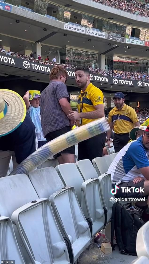 Fans in Bay 13 are known for pushing the boundaries when it comes to behavior, with activities such as building huge 'beer snakes' out of empty plastic cups (pictured)