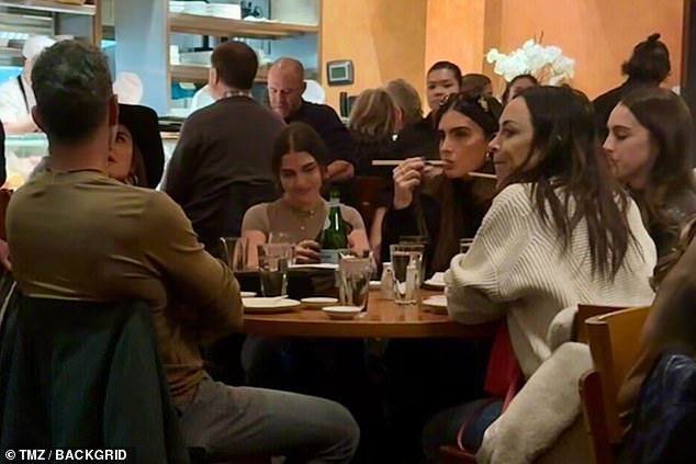 Amicable: The estranged couple sat next to each other as they dined and were reportedly 'cordial' according to eyewitnesses