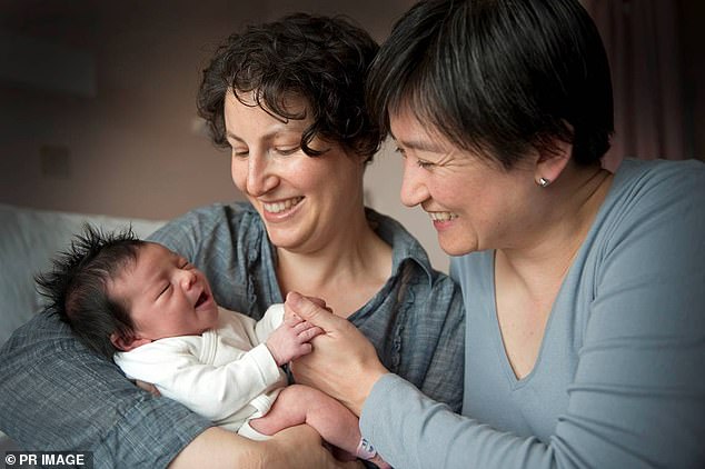 Senator Wong (right) and Mrs Allouache greet the arrival of their first daughter Alexandra in 2011