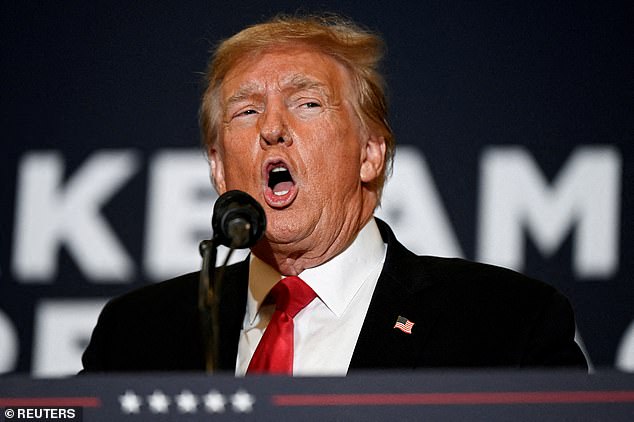 Former US President and Republican presidential candidate Donald Trump speaks during a 'Commit to Caucus' event for his supporters in Iowa=