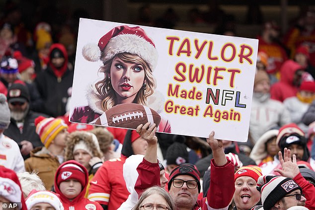 Fans in Kansas City hold up special banners in support of the pop star on Christmas Day