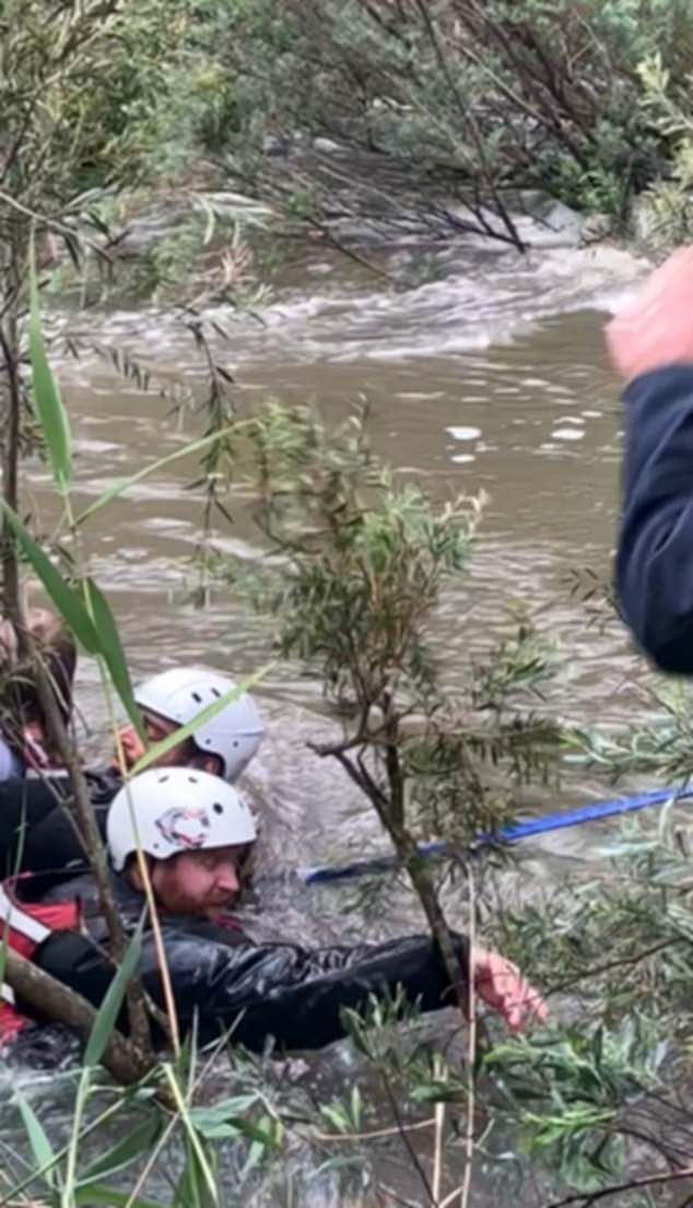 Madi jumped after Minka but had difficulty getting out of the river, which was deep after days of heavy rain