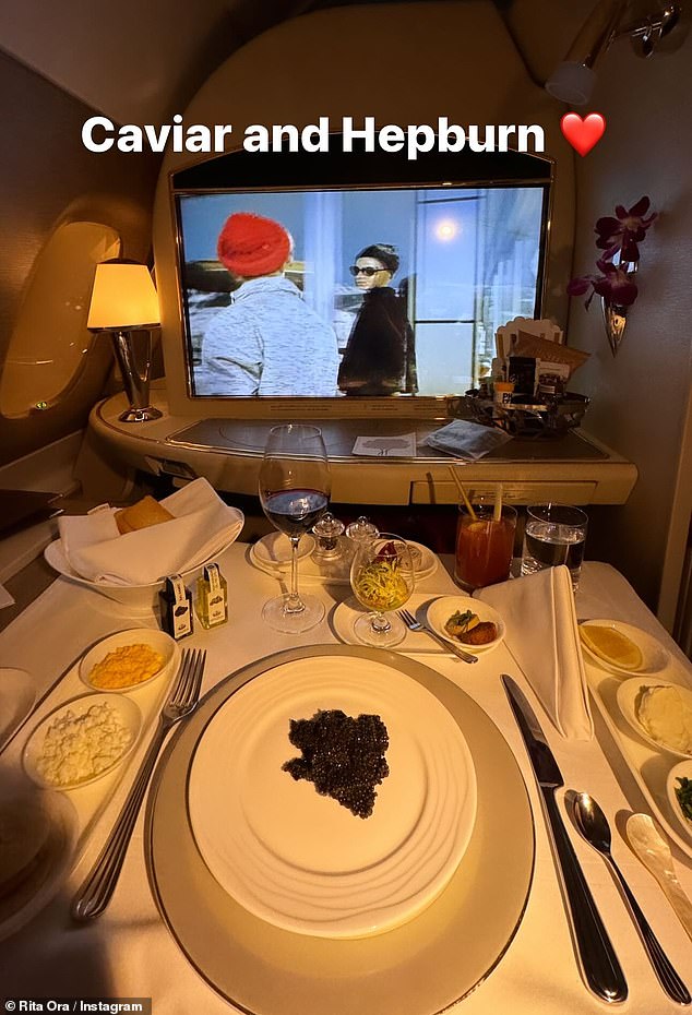 Rita took to Instagram to show off her life of luxury as she tucked into delicious caviar while watching the iconic Audrey Hepburn from her first class cabin in the sky