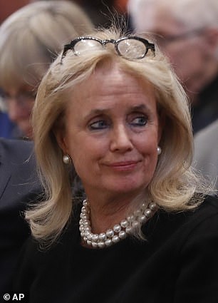Representative Debbie DIngel at her husband's funeral in 2019
